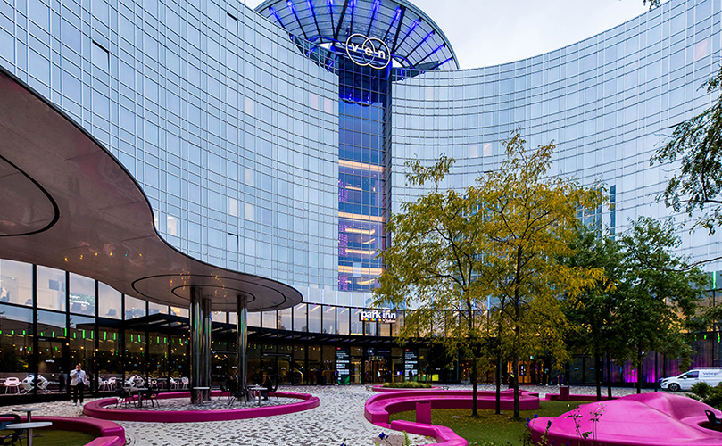 A building with a curved glass wall