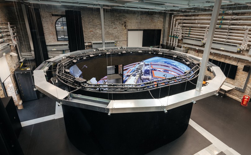 A large round black object with a screen on it.